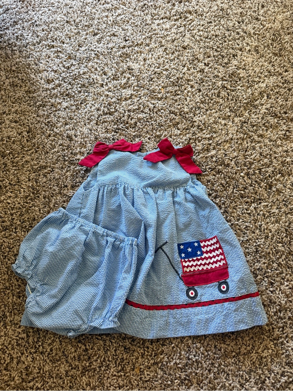 Petit Ami Light Blue Gingham Dress with Red Bows & Wagon Applique
